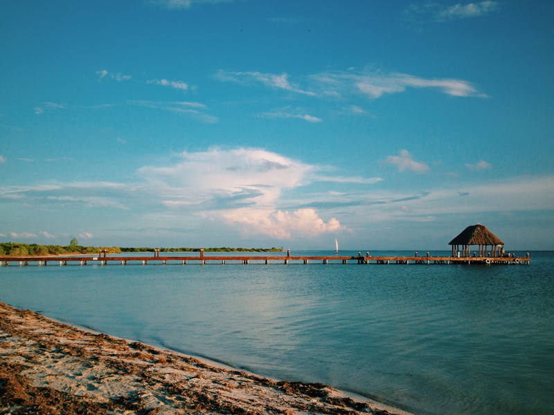 sea, building exterior, tranquility, outdoors, built structure, architecture, beach, sky, scenics - nature, waterfront, holbox, isla holbox, pier, travel