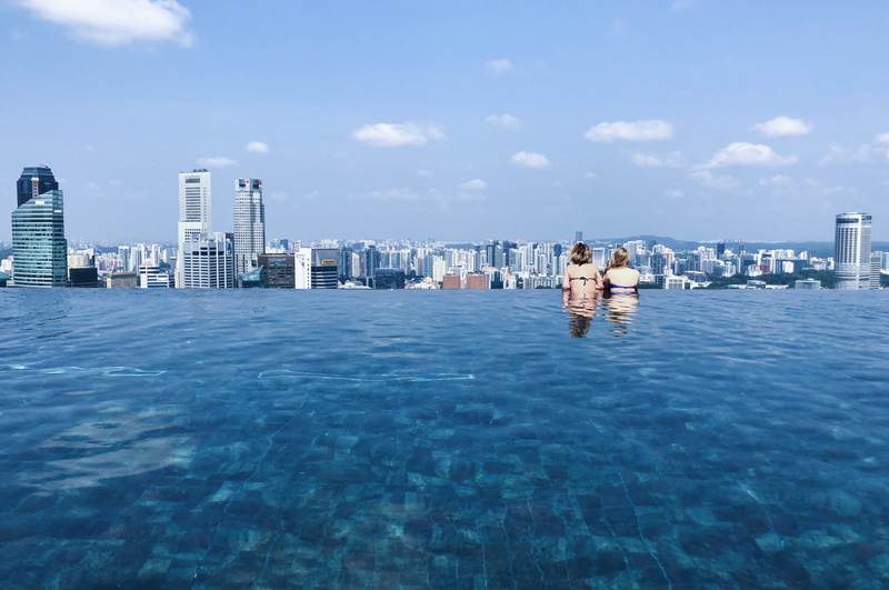 cloud - sky, skyscraper, overlook, financial district, outdoors, city, overlooking, modern, landscape, building exterior, s, waterfront, swimming pool