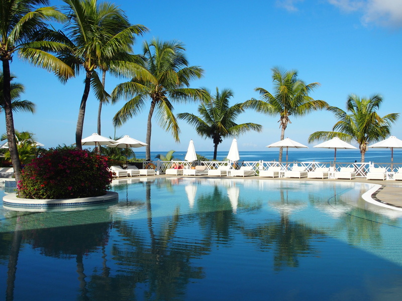 travel destinations, beach, maritime hotel, plant, waterfront, holiday, outdoor, sky, lounge chair, summer, surrounded, blue, ocean, swimming pool, tropical climate