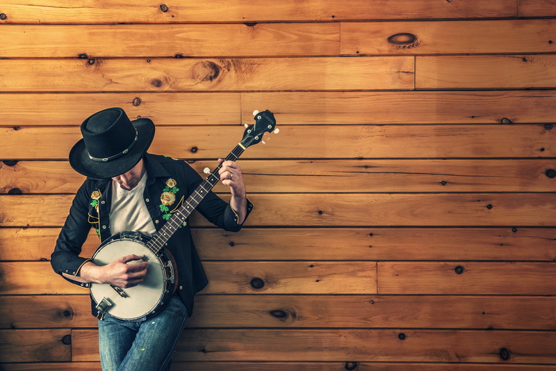 classic, clothing, arts culture and entertainment, adult, musical, country song, standing, guitar, jeans, instrument, music, shirt, sleeved, one person