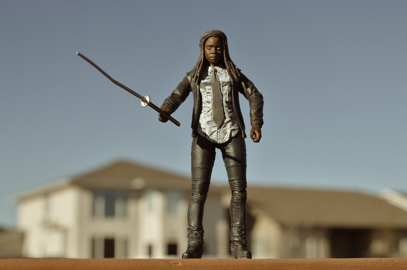 clear sky, full length, apocalypse, standing, building, human arm, sky, sword, woman, focus on foreground, 4K, walking dead, outdoors, casual clothing