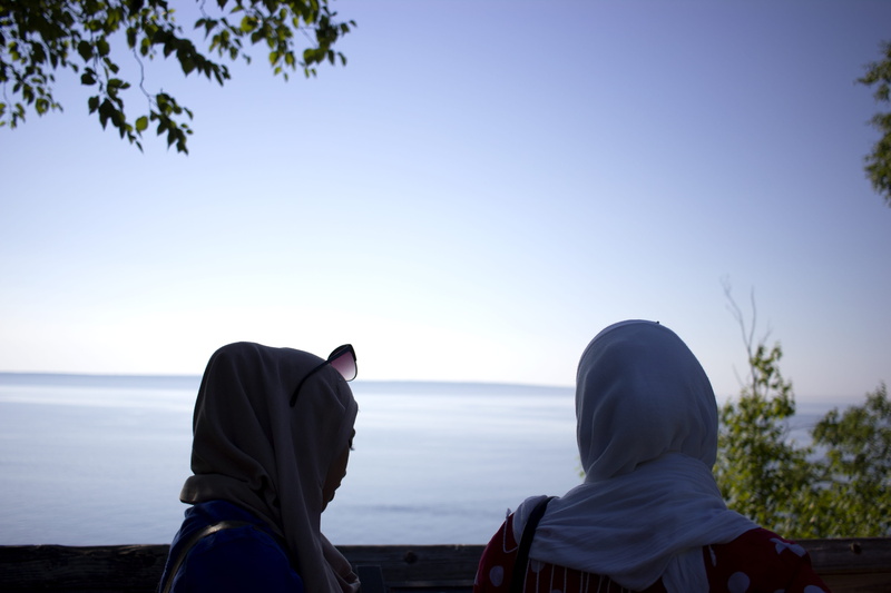 5K, beauty in nature, outdoors, land, real people, adult, muslim women, togetherness, people, horizon over water, hood - clothing, women, sea, lifestyles
