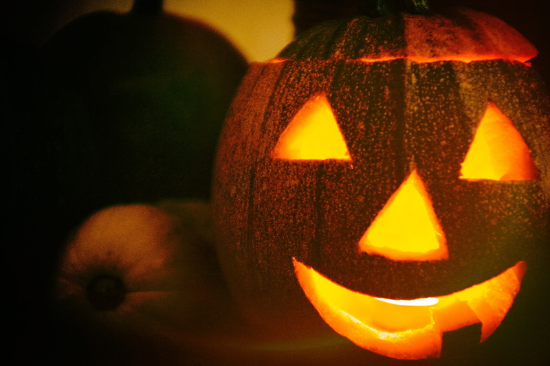 black background, celebration, jack o lantern, pumpkin carving, pumpkin, face, craft, indoors, smiling, plant, jack o lantern, vegetable, harvest, object