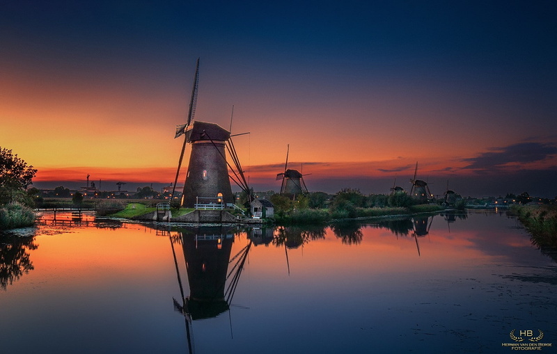 environmental conservation, windmill, orange color, photography, lake, sky, wind power, tranquility, turbine, waterfront, tranquil scene, no people, city