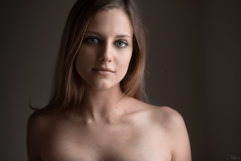 bare shoulders, beautiful woman, young adult, face, serious, one person, looking at camera, blue eyes, hair, adult, brunette, front view, beautiful people
