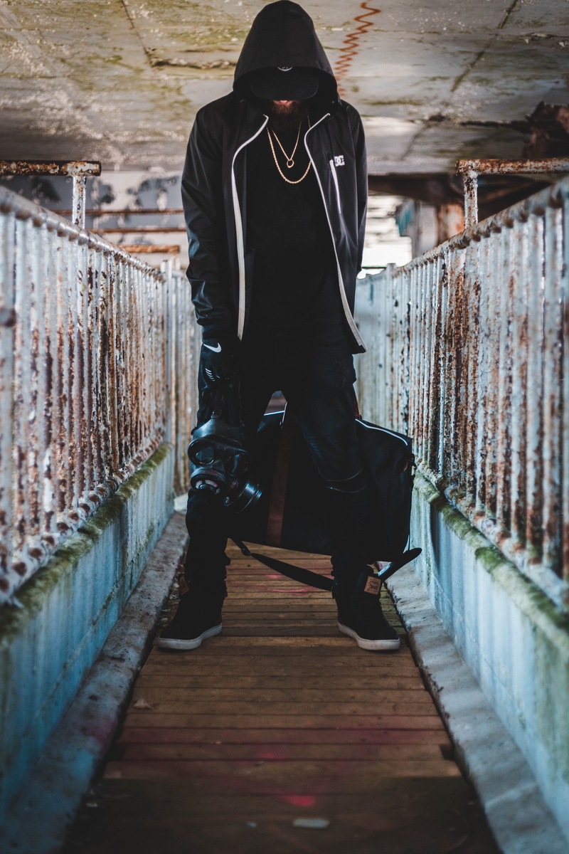 abandoned, one person, leisure activity, herschel, standing, 5K, urbex, bag, gas mask, wall, street, man, glofe, holding, streetwear, trend, brick wall