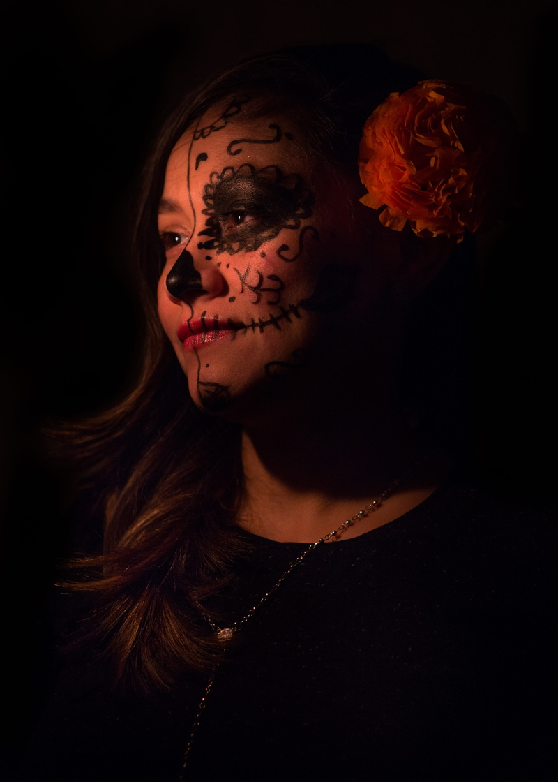 human face, front view, indoors, neck, young adult, woman, halloween, paint, 5K, inside, crew, top, looking at camera, black background, room, beautiful woman
