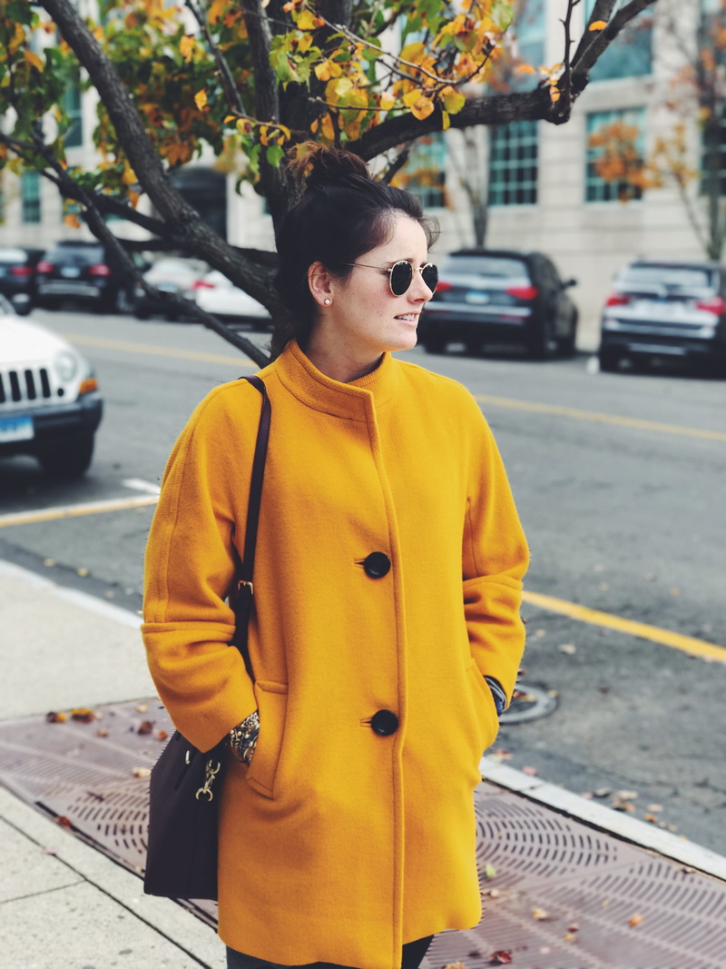woman, outdoors, motor vehicle, sunglasses, architecture, day, yellow, greenwich, road, one person, portrait, land vehicle, standing, mode of transportation