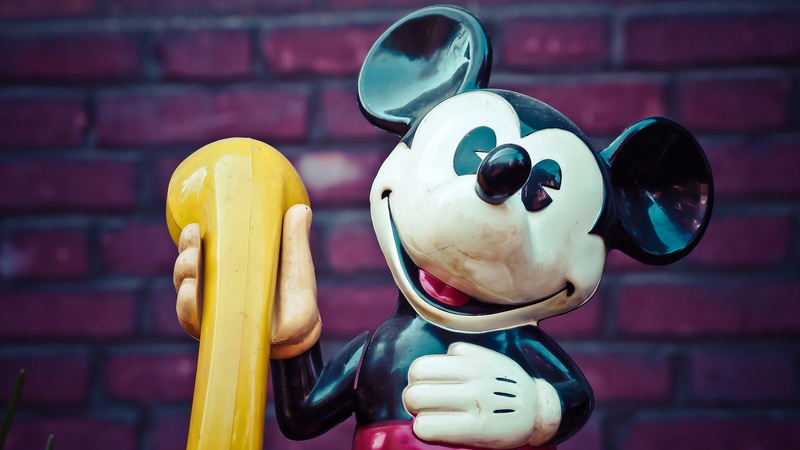 micky mouse, cartoon, no people, phone, banana, figure, creativity, close-up, cartoon character, brick wall, comic, focus on foreground, sweet, mickey