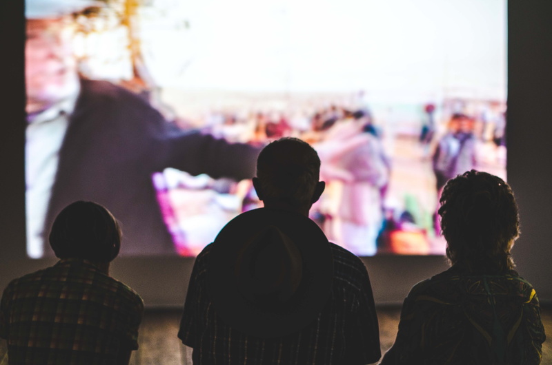 rear view, day, group of people, togetherness, leisure activity, focus on foreground, outdoors, performance, show, arts culture and entertainment, crowd
