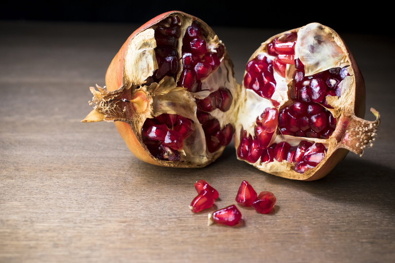 brown, no people, indoors, autumn, table, red fruit, vitamins, freshness, wooden, food and drink, pomegranate, granada, red, wood - material, still life