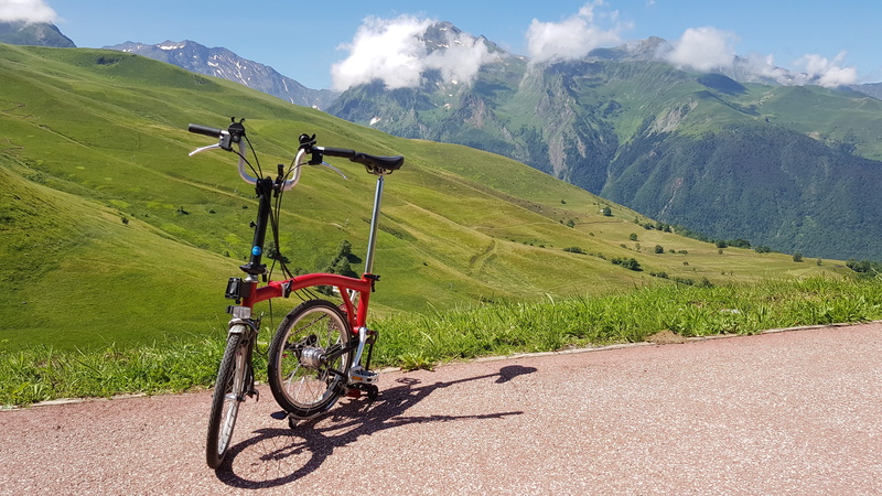 sky, mountain, folding bicycle, riding, day, tranquil scene, mountains, travel, environment, mode of transportation, beauty in nature, tranquility, bicycle