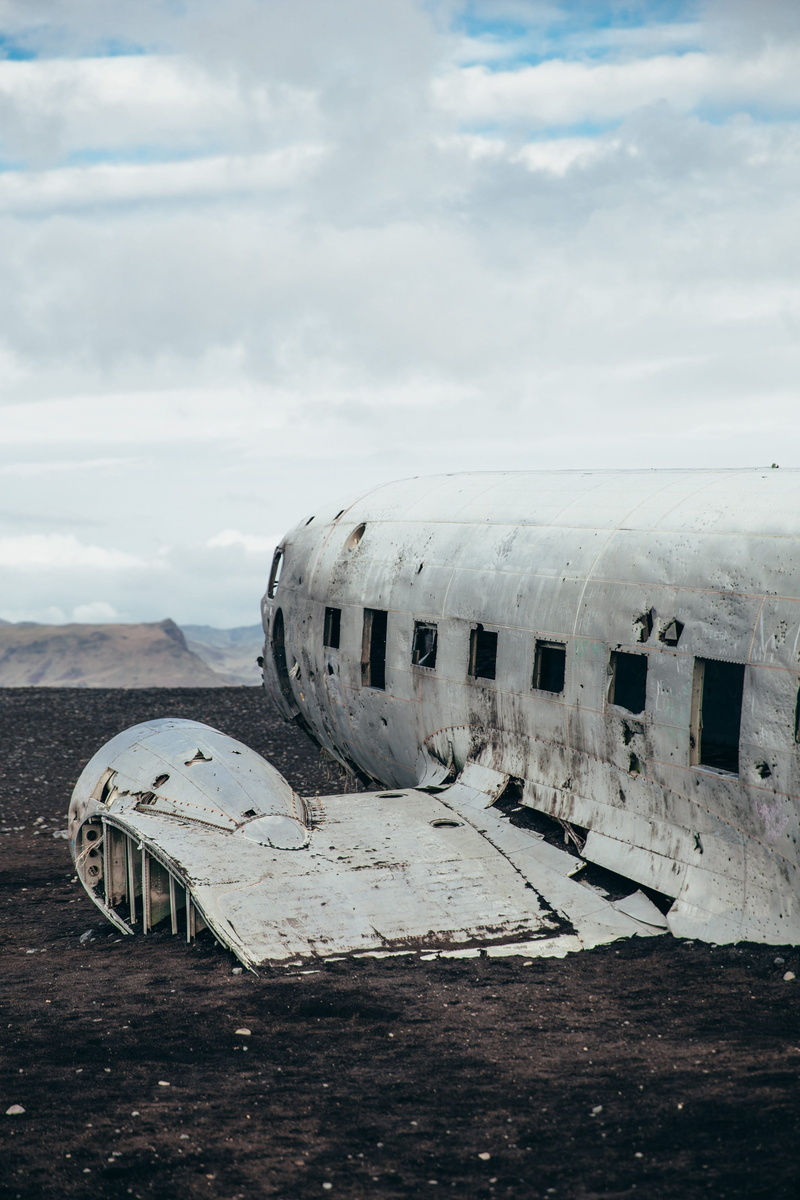 bent, damage, tourism, mountain, run-down, airfield, outdoors, mode of transportation, beach, deterioration, wreck, cloud - sky, destruction, abandoned