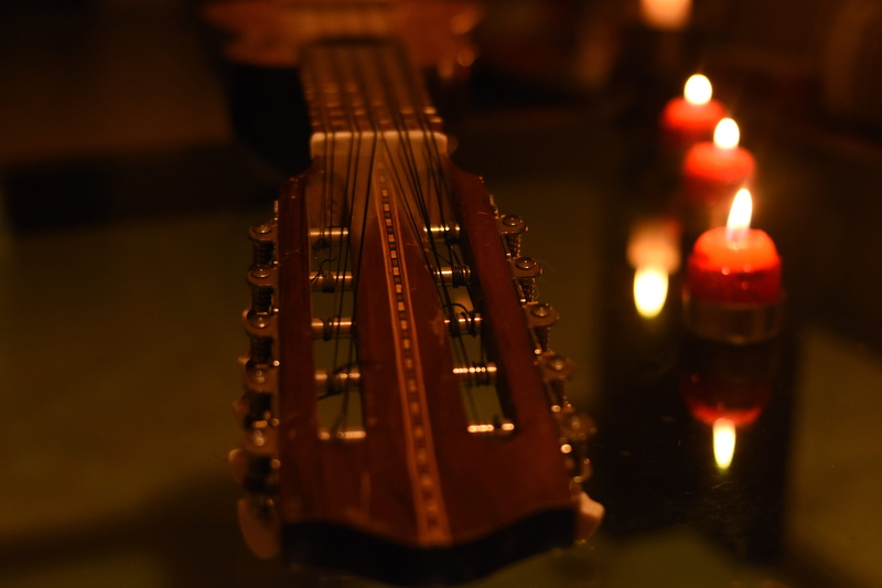 string, indoors, illuminated, guitar, selective focus, no people, burning, arts culture and entertainment, musical instrument, candle, musical instrument string