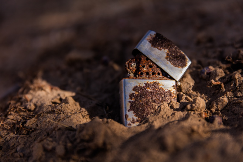 crystal, metal, selective focus, zippo, dirt, shiny, rust, silver colored, chocolate, day, black background, close-up, brown, single object, food, indoors
