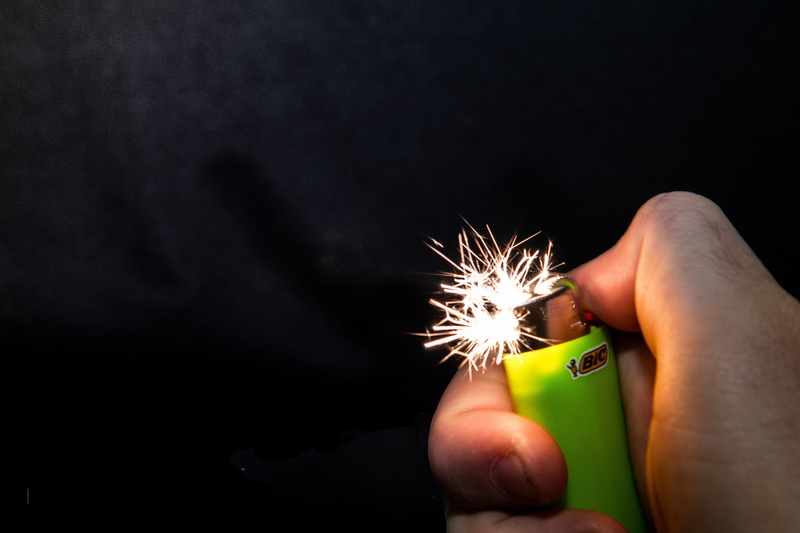 studio shot, fire, snapshot, flame, indoors, burns, ignition, burn, fire - natural phenomenon, copy space, thumb, black background, burning, human hand