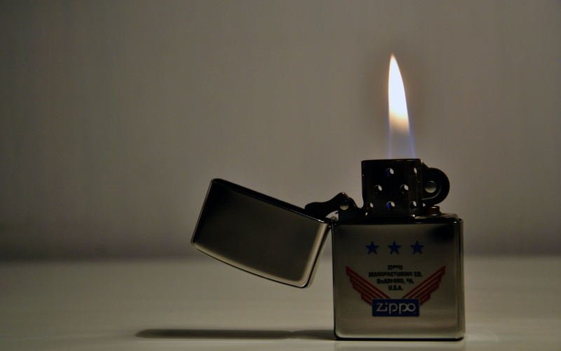 lighter, fire, flame, indoors, nature, sign, close-up, no people, glowing, heat - temperature, focus on foreground, table, western script, 2K, number