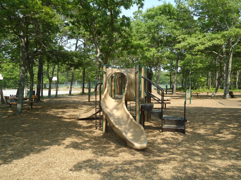 growth, land, park, slide - play equipment, outdoor play equipment, no people, shadow, childrens, green color, shade, park - man made space, empty, slide
