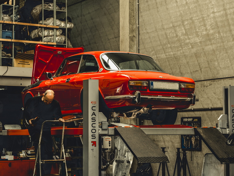 day, human, vehicle, truck, people, car, building, standing, architecture, real people, city, motor vehicle, occupation, working, construction site, workshop