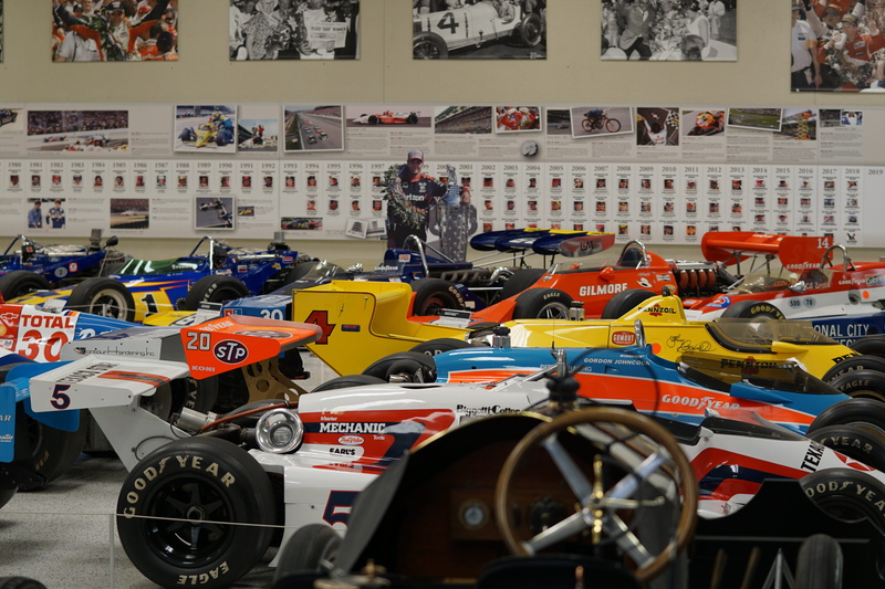 person, city, collection, car show, representation, color, human, car, mode of transportation, large group of objects, real people, clothing, apparel, incidental people