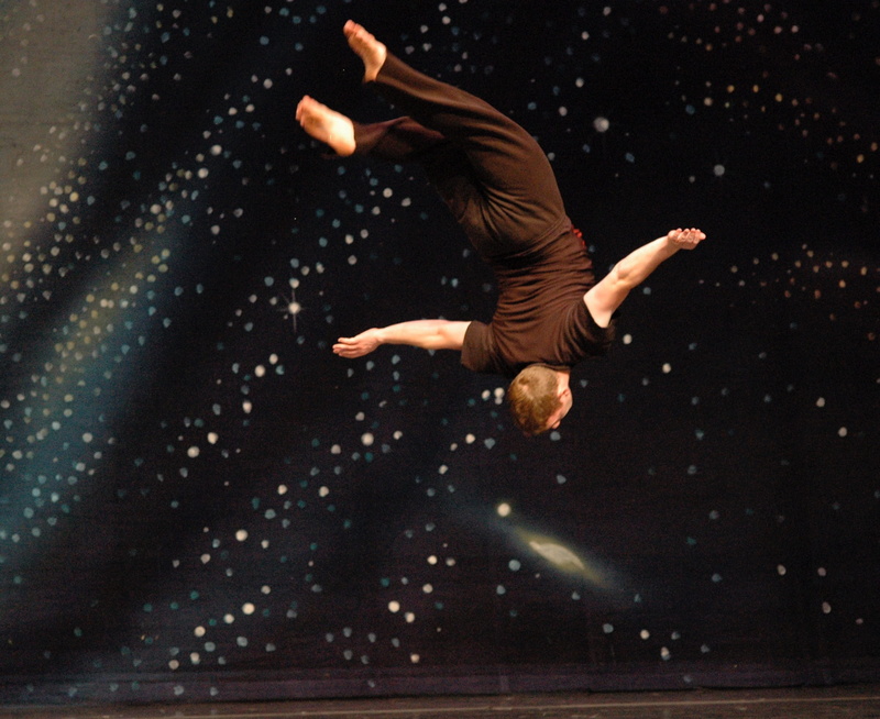black, one person, excitement, zero gravity, enjoyment, mid-air, 1080P, arms raised, acrobat, night, vitality, Gymnast, full length, fun, performer, background