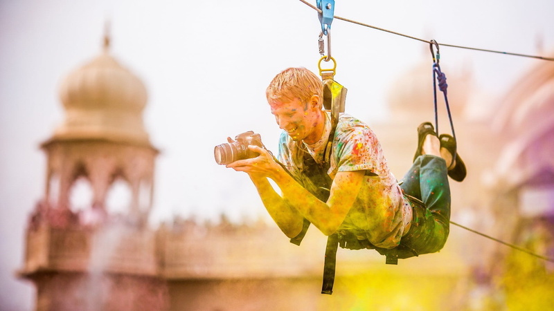 men, outdoors, black, smiling, child, fun, holi festival , offspring, hanging, day, motion, childhood, architecture, focus on foreground, full length, built structure