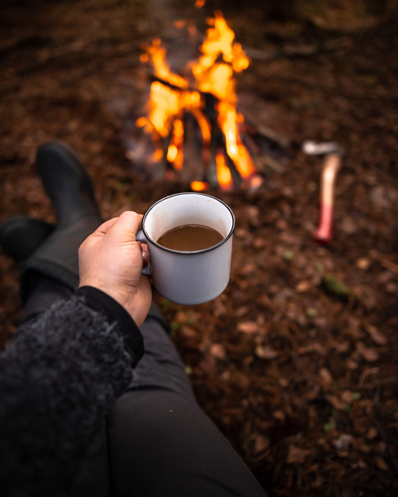mug, outdoors, nature, burning, holding, real people, human hand, rain, cup, fire - natural phenomenon, person, fire, forest, white, bonfire, chill, heat - temperature