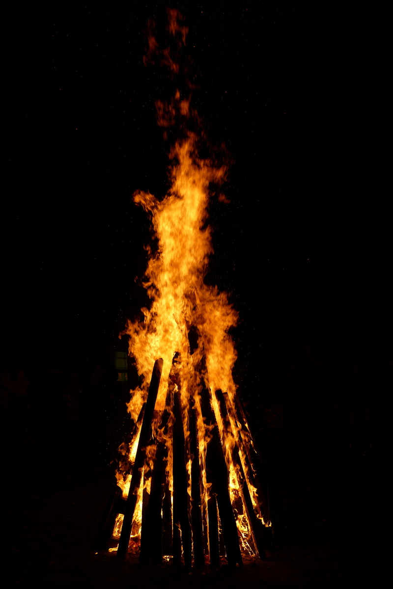 outdoors, heat - temperature, st martin, wood - material, yellow, sky, heat, campfire, bonfire, event, black background, glowing, smoke - physical structure