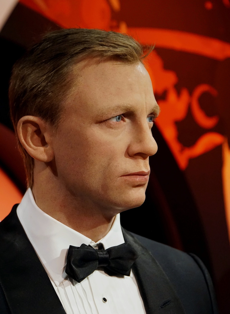 looking away, focus on foreground, role, bow tie, loop, film, young men, portrait, daniel craig, 007, likeness, formalwear, exhibition, young adult, suit