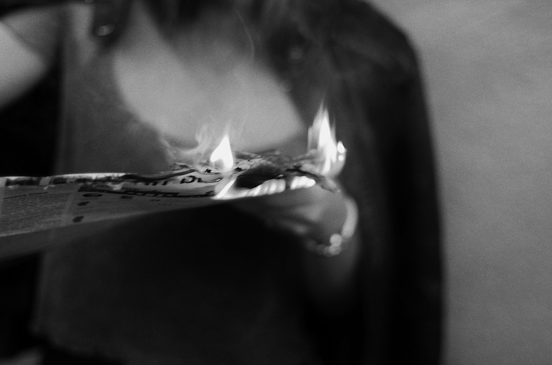 bonfire, flame, beautiful woman, dice, indoors, hairstyle, holding, body part, human mouth, glass, beauty, human body part, skin, game, fire, finger, person