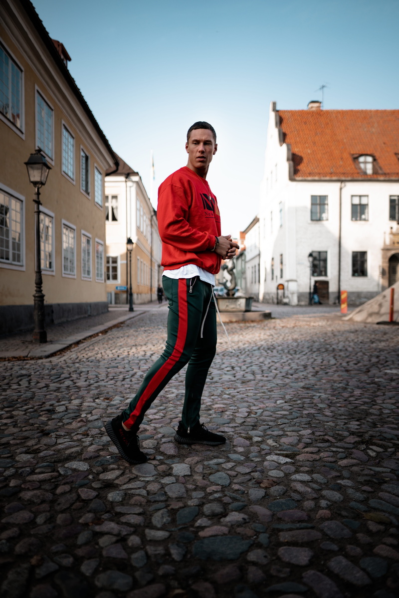 front view, portrait, sidewalk, street, walkway, town, city, architecture, day, one person, building exterior, standing, village, leisure activity, apparel