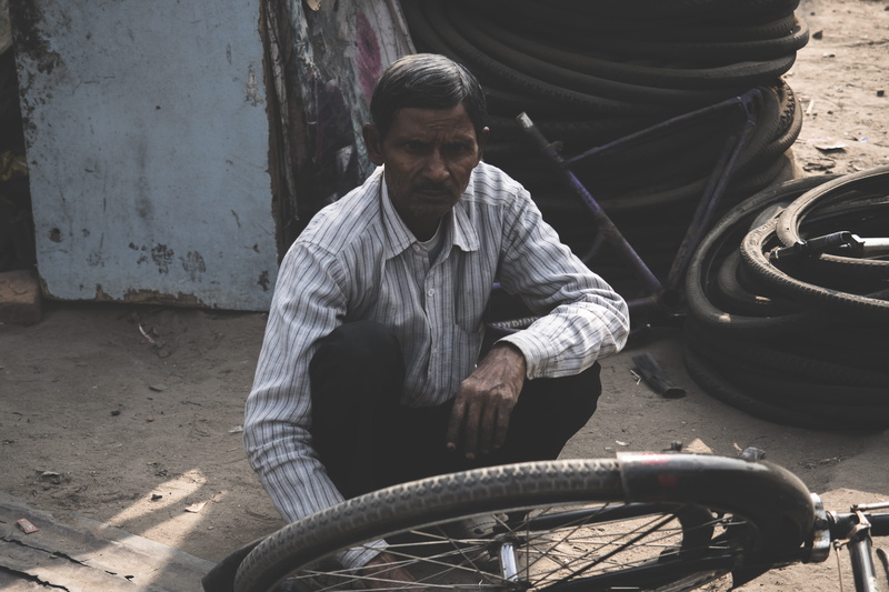 man, casual clothing, outdoors, shop, wheels, young adult, tire, bike, skill, eldery, hardwork, working, young men, udaipur, mode of transportation, transportation