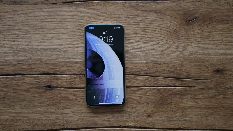 no people, lockscreen, stereo, electronics, directly above, still life, touch screen, ipod shuffle, blue, wood - material, contact lens, wood, connection