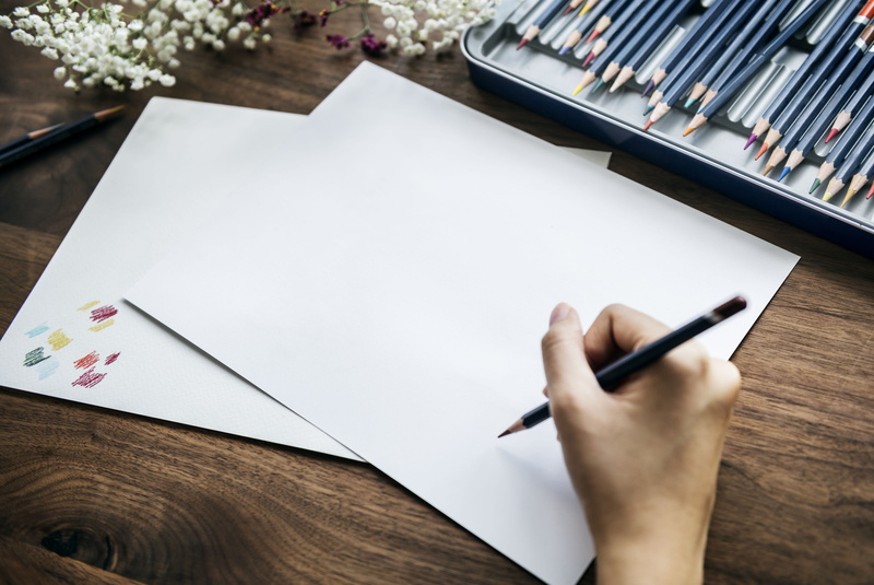 real people, blank, creativity, text, artist, bright, human body part, design, one person, pen, paper, hand, work, table, human hand, writing instrument