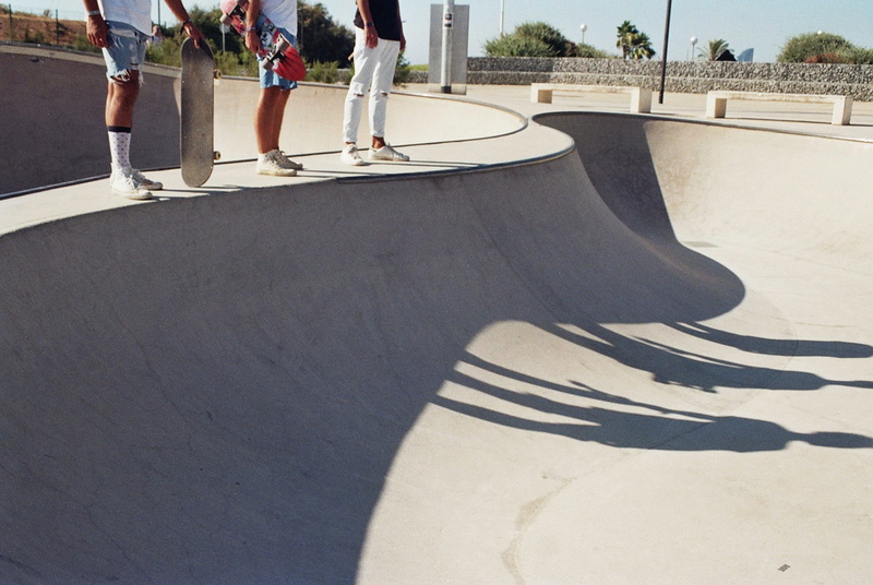 persons, skateboard, standing, sports equipment, skaters, shadow, male, leisure activity, skate, person, skateboard park, youth, sport, gray, people, day