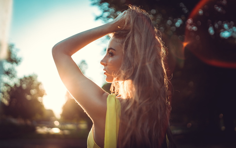 Marco Squassina, human arm, long hair, hand in hair, lifestyles, women, portrait, one person, hair, sunlight, headshot, dress, outdoors, focus on foreground
