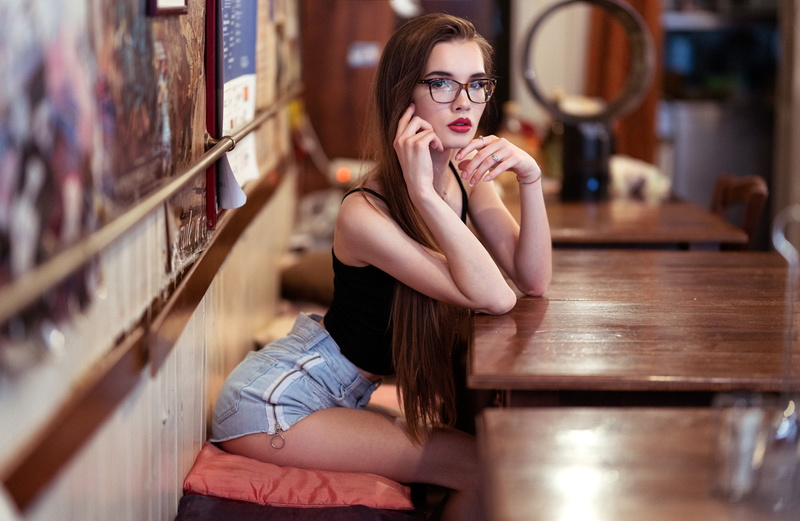 black tops, red lipstick, 1080P, sitting, jean shorts, tank top, table, long hair, Marco Squassina, women with glasses, women