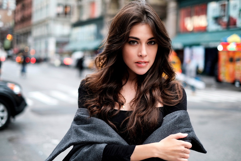 looking, coats, biting lip, architecture, hairstyle, front view, arms crossed, focus on foreground, portrait, women outdoors, one person, women, transportation