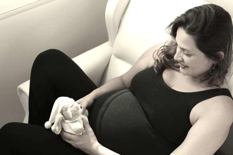 looking, baby, women, pregnant, holding, one person, bear, black color, 4K, lifestyles, three quarter length, mother, sofa, young adult, real people, pregnancy