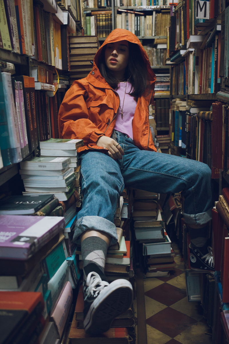 fashion, woman, one person, bookshelves, books, casual, publication, bookstore, stock, indoors, knowledge, book series, education, sit, jeans, model, photoshoot