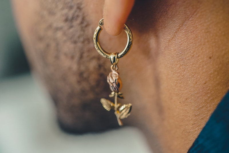hand, 4K, men, wearing, accessories, earrings, indoors, neck, accessory, casual clothing, fire, bowl, man, adult, colored, locket, pendant, ankle, close-up