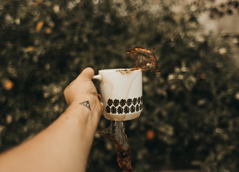 drink, unrecognizable person, body part, clothing, cup, insect, mug, food, day, latte, accessory, food and drink, glass, personal perspective, freshness
