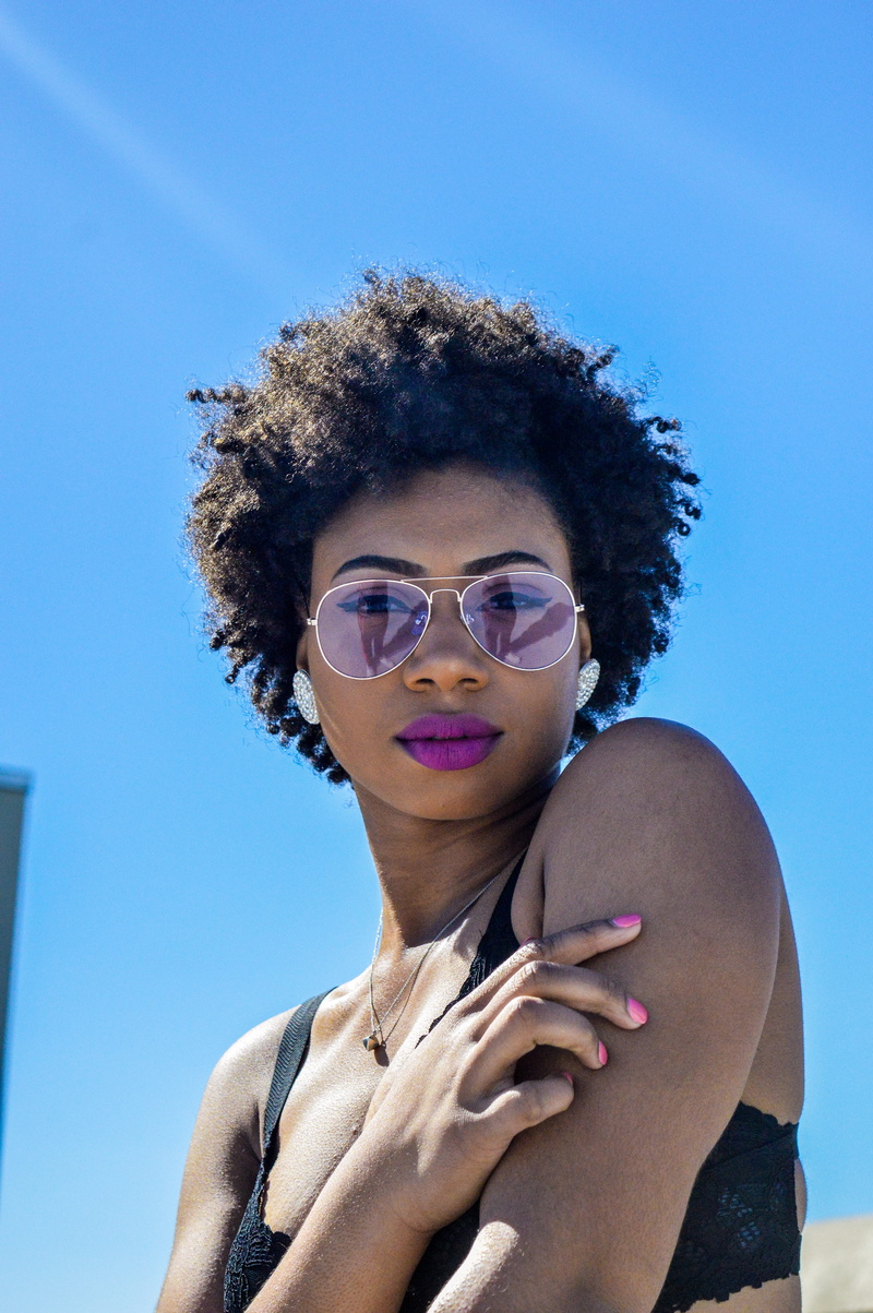 taking, hair, sky, sunglasses, lip, female, afro hairstyle, mouth, bronze, day, human, person, leisure activity, one person, headshot, portrait, outdoors