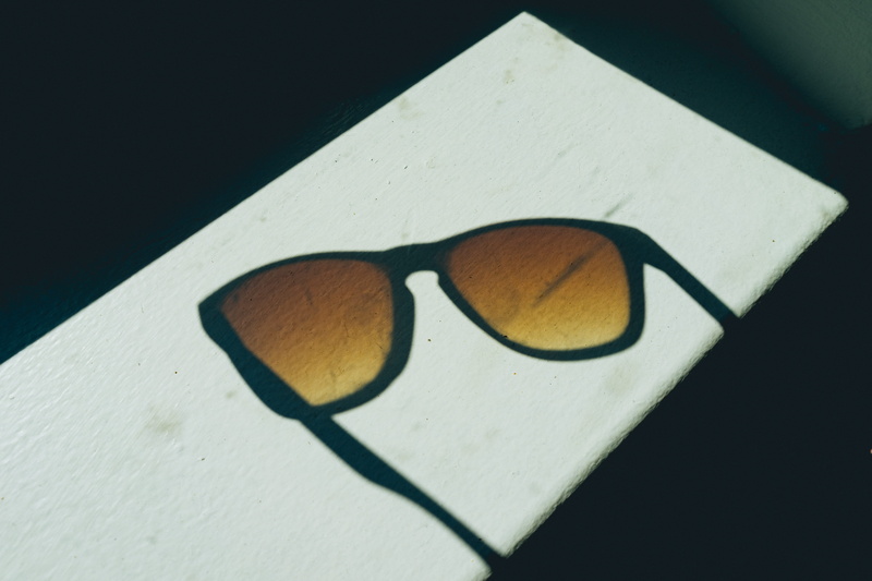 close-up, single object, studio shot, black, table, creativity, glasses, triangle shape, black color, indoors, sun, window, personal accessory, art and craft