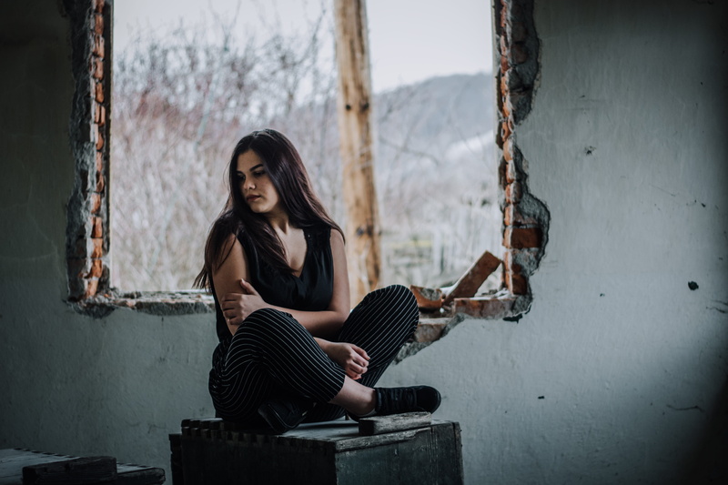 beauty, looking at camera, top, abandoned building, box, hair, day, one person, brunette, wooden, outdoors, looking away, lifestyles, hairstyle, leisure activity