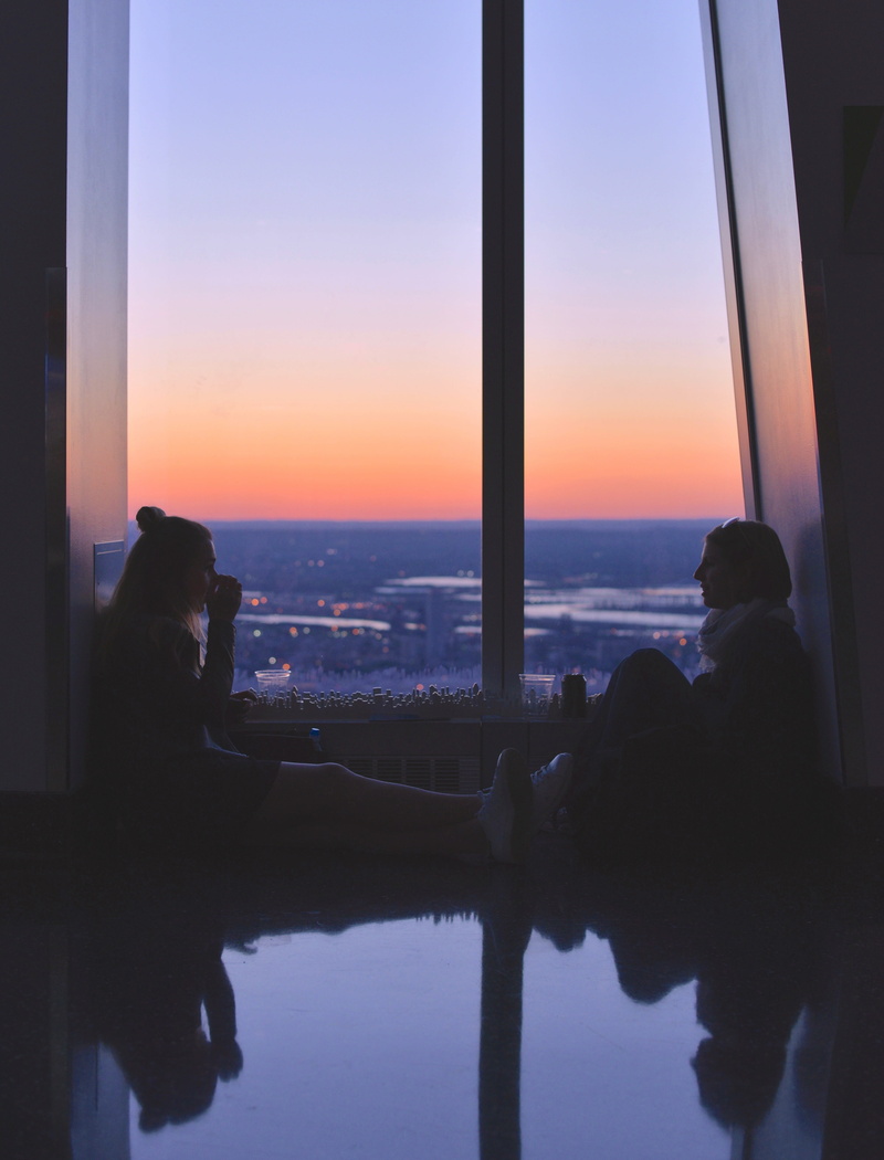 couple, tranquil Scene, looking, looking At View, city street, females, city, reflection on floor, sun, silhouette, lifestyles, two, reflection, new york