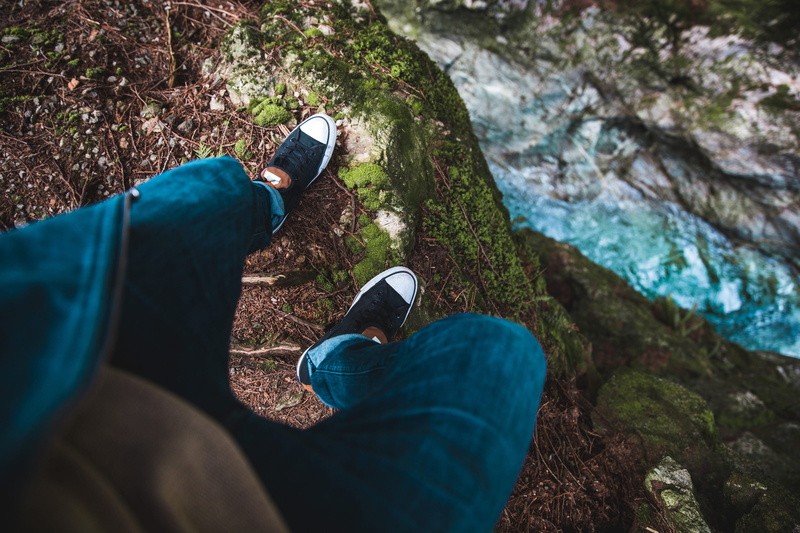 day, body part, background, people, relax, shoes, mountain, rock - object, legs, adult, stepping, outdoors, solid, cliff, jeans, land, adventure, waterfall