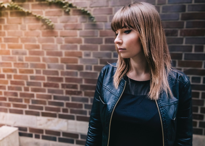 one person, brick wall, woman, portrait, women, people, 4K, wall, standing, girl, black, lifestyles, blonde, brick, wall - building feature, depression - sadness