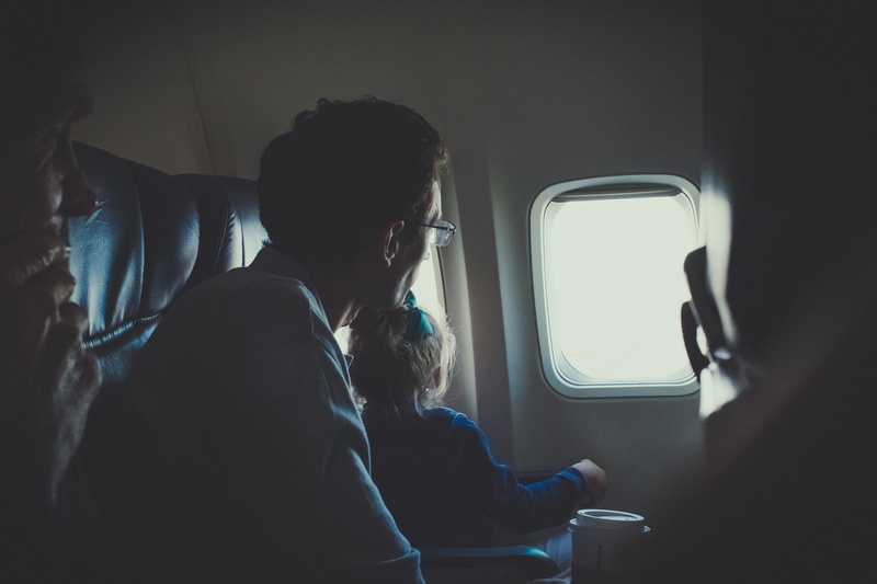 vehicle seat, 4K, flight, looking out the window, airplane, adult, window, photo, looking through window, vehicle interior, sitting, indoors, travel, male