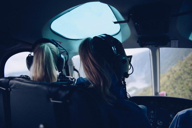 real people, rear view, females, cockpit, two People, mode of transportation, people, using, inside Of, lifestyles, earphones, driving, women, navigator